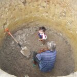 Father and Son in Dry Well Father and Son in Dry Well